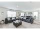 Spacious living room with sectional sofa and large windows at 1839 Wild Rye Way, Kissimmee, FL 34744