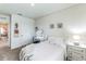 Bright bedroom with a full-size bed and a dresser at 1839 Wild Rye Way, Kissimmee, FL 34744