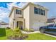 Two-story house with a garage and landscaped lawn at 1839 Wild Rye Way, Kissimmee, FL 34744