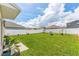 Fenced-in backyard with grassy lawn at 1839 Wild Rye Way, Kissimmee, FL 34744