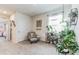 Cozy sitting area with comfortable chair and many plants at 1839 Wild Rye Way, Kissimmee, FL 34744