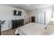 Spacious bedroom with a dresser and a queen-size bed at 1839 Wild Rye Way, Kissimmee, FL 34744