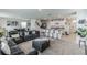 Open kitchen with island, white cabinets, and stainless steel appliances at 1839 Wild Rye Way, Kissimmee, FL 34744