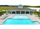 Relaxing community pool with a covered pavilion and lounge chairs at 3863 Malawi Trl, Saint Cloud, FL 34772