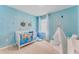 bedroom with ocean theme, teepee, and crib at 3863 Malawi Trl, Saint Cloud, FL 34772