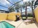 Relaxing poolside area with grill and lounge chair at 2937 Banana Palm Dr, Kissimmee, FL 34747