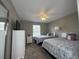 Bedroom with two twin beds, ceiling fan, and window at 2937 Banana Palm Dr, Kissimmee, FL 34747