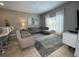 Living room with comfortable seating and access to kitchen and dining areas at 2937 Banana Palm Dr, Kissimmee, FL 34747