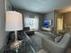 Living room with comfortable seating and large TV at 2937 Banana Palm Dr, Kissimmee, FL 34747