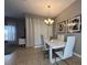 Bright dining area with a modern white table and six chairs at 2937 Banana Palm Dr, Kissimmee, FL 34747