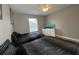 Bedroom with two twin beds, ceiling fan, and window at 2937 Banana Palm Dr, Kissimmee, FL 34747