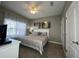 King-size bed, ceiling fan, and large windows at 2937 Banana Palm Dr, Kissimmee, FL 34747
