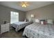 Bedroom with two twin beds, ceiling fan, and window at 2937 Banana Palm Dr, Kissimmee, FL 34747