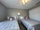 Spacious bedroom with two twin beds and ample closet space at 2937 Banana Palm Dr, Kissimmee, FL 34747