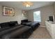 Bright bedroom featuring two twin beds and a flat-screen TV at 2937 Banana Palm Dr, Kissimmee, FL 34747