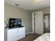 King-size bed, dresser, and TV at 2937 Banana Palm Dr, Kissimmee, FL 34747