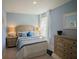 Cozy bedroom with light-colored furnishings and ample natural light at 1629 Andover Ridge Dr, Deland, FL 32720