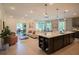Open concept kitchen with island and living area at 1629 Andover Ridge Dr, Deland, FL 32720