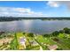 Aerial view of waterfront property with houses and lush landscape at 33 S Ortman Dr, Orlando, FL 32805
