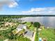 Aerial view of a house with lake view and tropical landscaping at 33 S Ortman Dr, Orlando, FL 32805