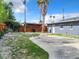 Backyard with wooden fence, gravel, and a covered patio area at 33 S Ortman Dr, Orlando, FL 32805