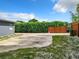 Side yard with a wooden fence and a paved area at 33 S Ortman Dr, Orlando, FL 32805
