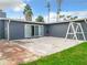 Spacious backyard with patio and swing set at 33 S Ortman Dr, Orlando, FL 32805