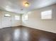 Bright living room featuring dark wood flooring at 33 S Ortman Dr, Orlando, FL 32805