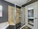 Bathroom with shower, tub and slate tile flooring at 33 S Ortman Dr, Orlando, FL 32805