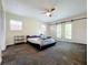 Main bedroom with sliding doors to backyard and ceiling fan at 33 S Ortman Dr, Orlando, FL 32805