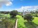 Expansive backyard with lake access, dock, and lush green space at 33 S Ortman Dr, Orlando, FL 32805