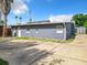 Gray house exterior with driveway and shed at 33 S Ortman Dr, Orlando, FL 32805