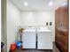 Laundry room with washer, dryer, and extra storage at 33 S Ortman Dr, Orlando, FL 32805