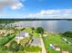 Aerial view of lakefront property with city skyline in the background and lush green surroundings at 33 S Ortman Dr, Orlando, FL 32805