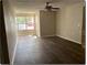 Spacious living area with wood-look flooring and large window at 5164 Conroy Rd # 1514, Orlando, FL 32811