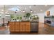Open concept kitchen with island and stainless steel appliances at 301 Richard Pl, Orlando, FL 32806