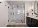 Spa-like bathroom with a large walk-in shower and marble tile at 301 Richard Pl, Orlando, FL 32806