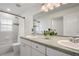 Clean bathroom with double vanity and terrazzo countertop at 301 Richard Pl, Orlando, FL 32806