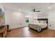 Main bedroom with wood-look floors and large window at 301 Richard Pl, Orlando, FL 32806