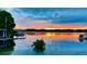 Stunning lake view at sunset with a dock at 301 Richard Pl, Orlando, FL 32806