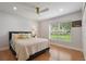 Charming bedroom with hardwood floors and a view of the backyard at 301 Richard Pl, Orlando, FL 32806