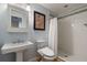 Small bathroom with pedestal sink and shower at 301 Richard Pl, Orlando, FL 32806