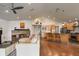 Open concept living room with fireplace and kitchen view at 301 Richard Pl, Orlando, FL 32806