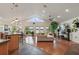 Open living area with hardwood floors, vaulted ceiling, and water views at 301 Richard Pl, Orlando, FL 32806