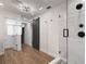 Modern bathroom with a glass shower and barn door at 301 Richard Pl, Orlando, FL 32806