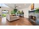 Cozy living room with a stone fireplace and hardwood floors at 301 Richard Pl, Orlando, FL 32806