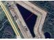 Aerial view showing a triangular lot near Sagefield Dr and a lake at 4379 Sagefield Dr, St Cloud, FL 34773
