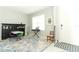 Cozy play room features a table, chairs, keyboard, and bookshelves at 1186 August Sky Dr, Deltona, FL 32738