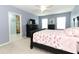Bright bedroom featuring a comfy bed and ensuite bathroom access at 1186 August Sky Dr, Deltona, FL 32738