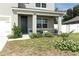 Landscaped front yard with flowers and plants near the house entrance at 1186 August Sky Dr, Deltona, FL 32738